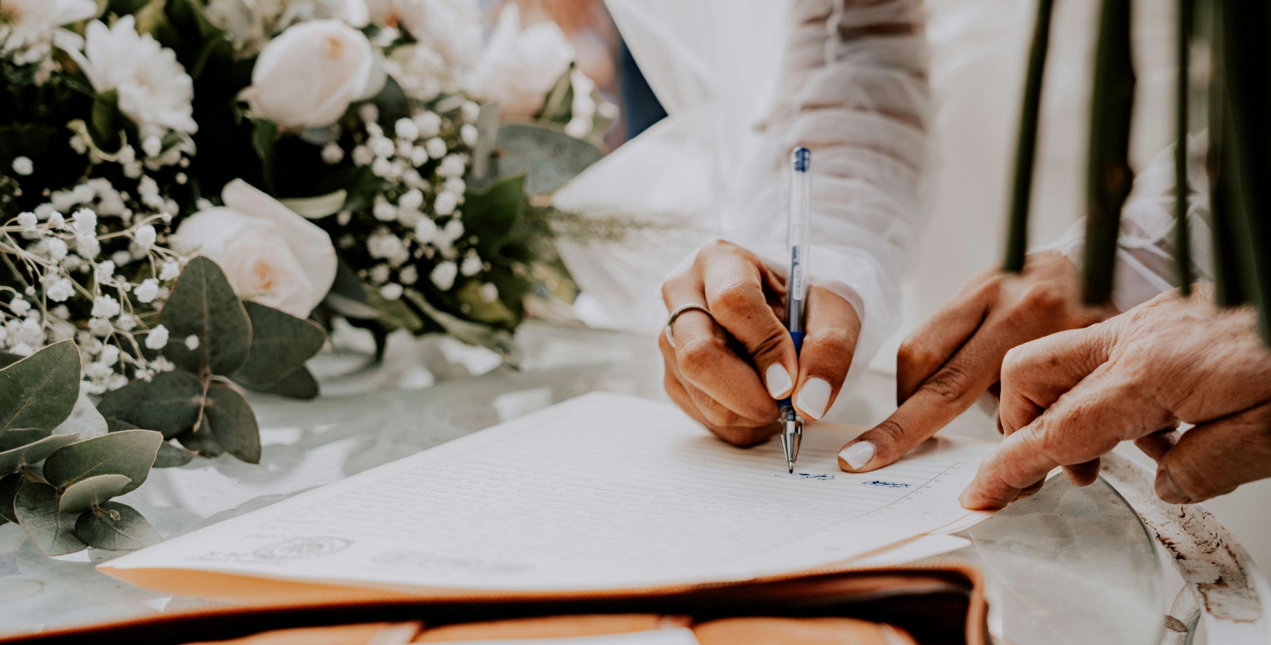 bride signing legal wedding documents